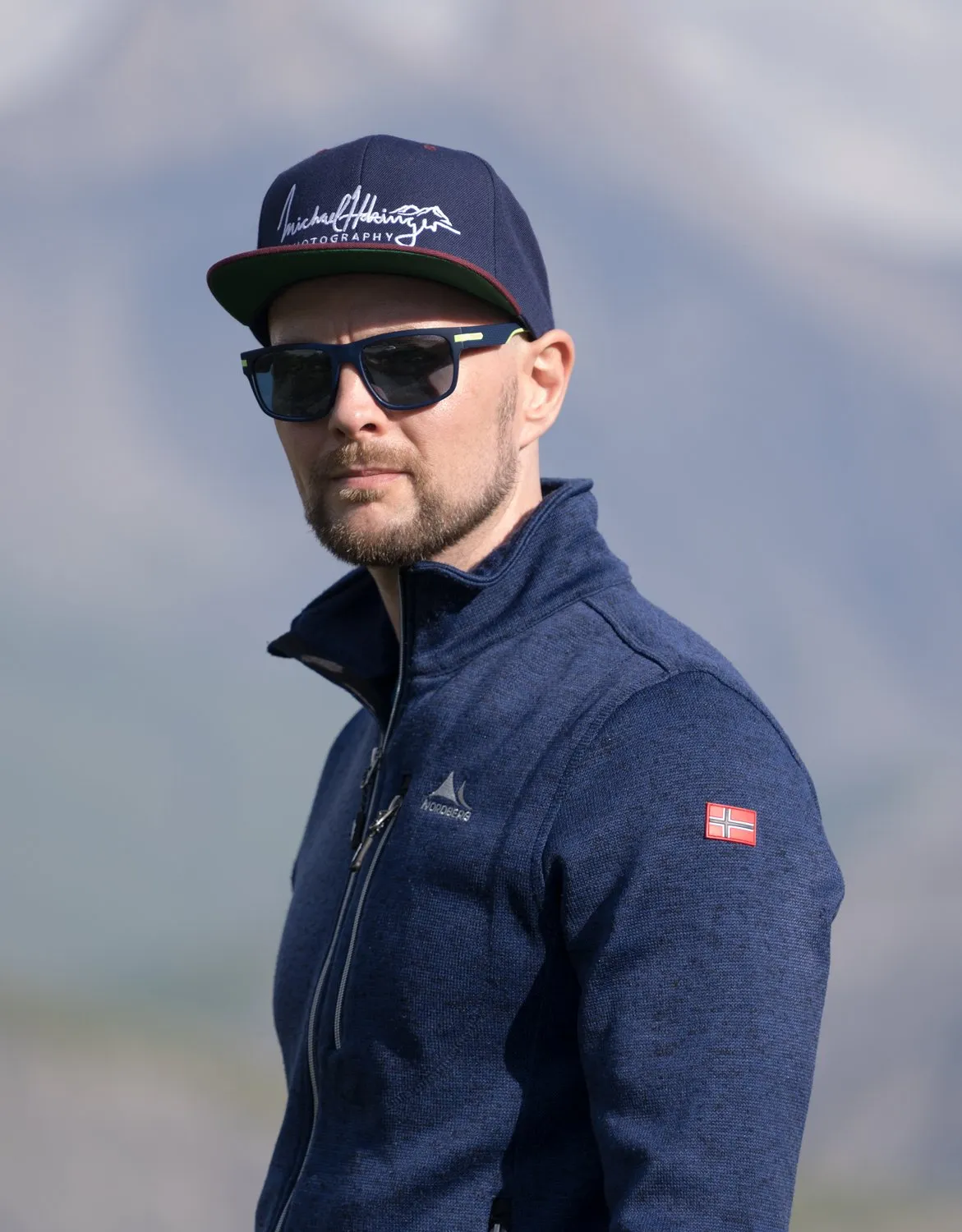 Portrait of Michael Holzinger with cap and sunglasses