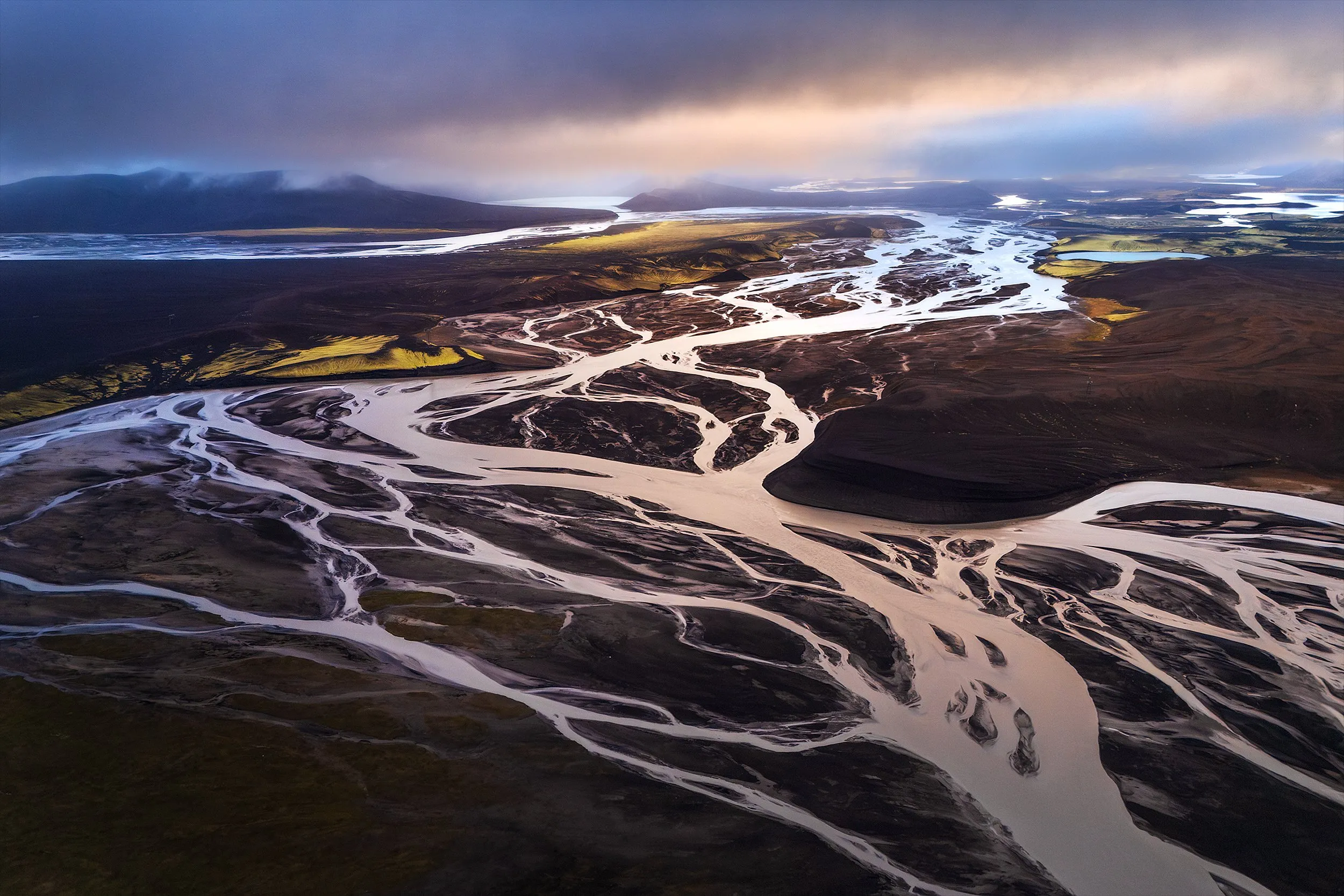 A braided river delta threading through volcanic sandur plains.